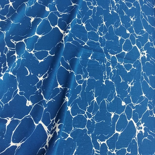 Blue And White Marble Print On Snake Crepe Fabric